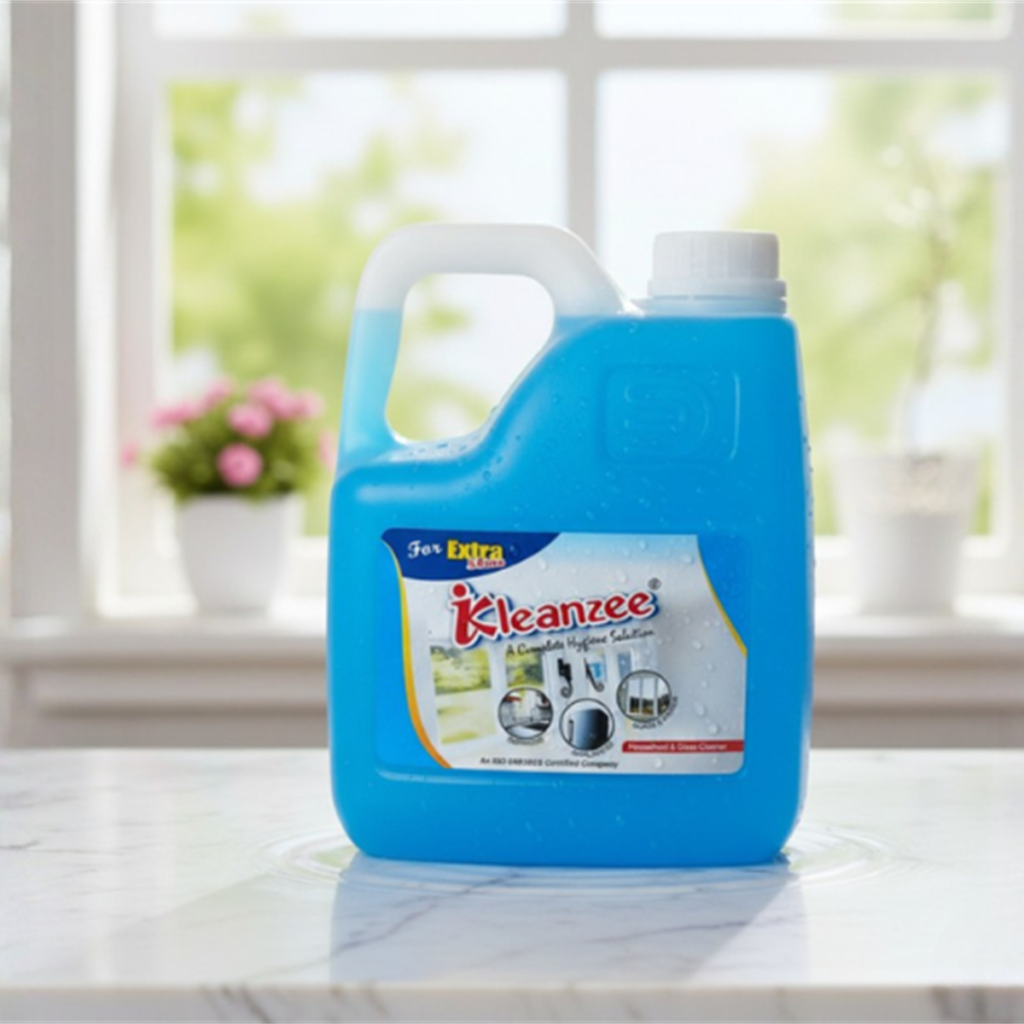 A large blue 5-liter container of IKleanzee glass cleaner liquid with a white handle and cap, positioned on a white marble ledge.
