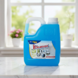 A large blue 5-liter container of IKleanzee glass cleaner liquid with a white handle and cap, positioned on a white marble ledge.