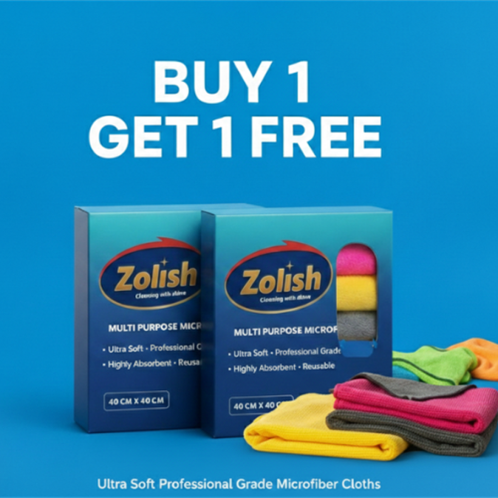 Two blue boxes of Zolish Multi Purpose Microfiber Cloths on a blue background with a "BUY 1 GET 1 FREE" promotion. Several folded cloths in pink, yellow, grey, green, and orange are displayed in the foreground.